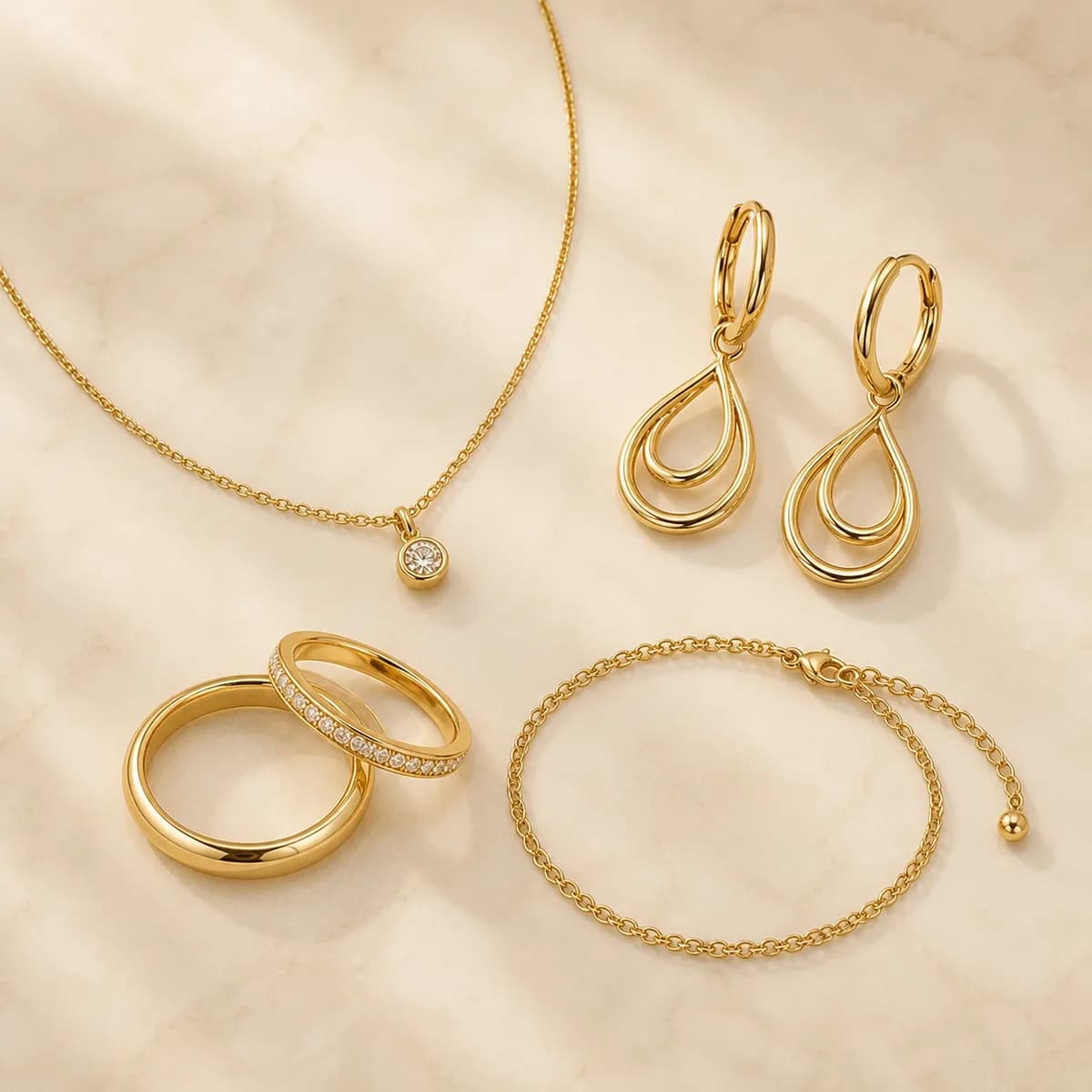 Aurnelia jewellery arranged on a light surface